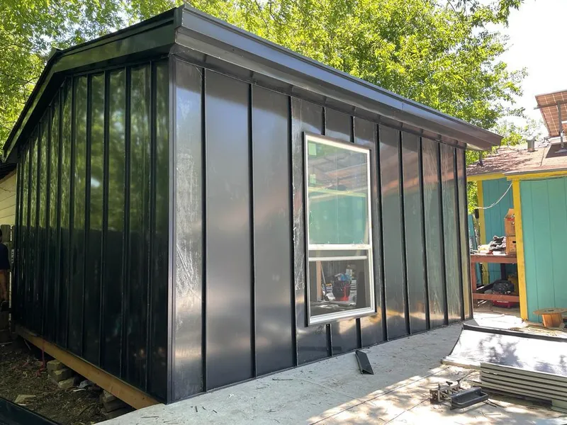 Black standing seam metal wall panels for Roof Inspection in Greenacres