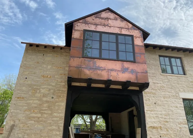 Copper metal panel facade on a stone building for Metal Roof Coating in Greenacres